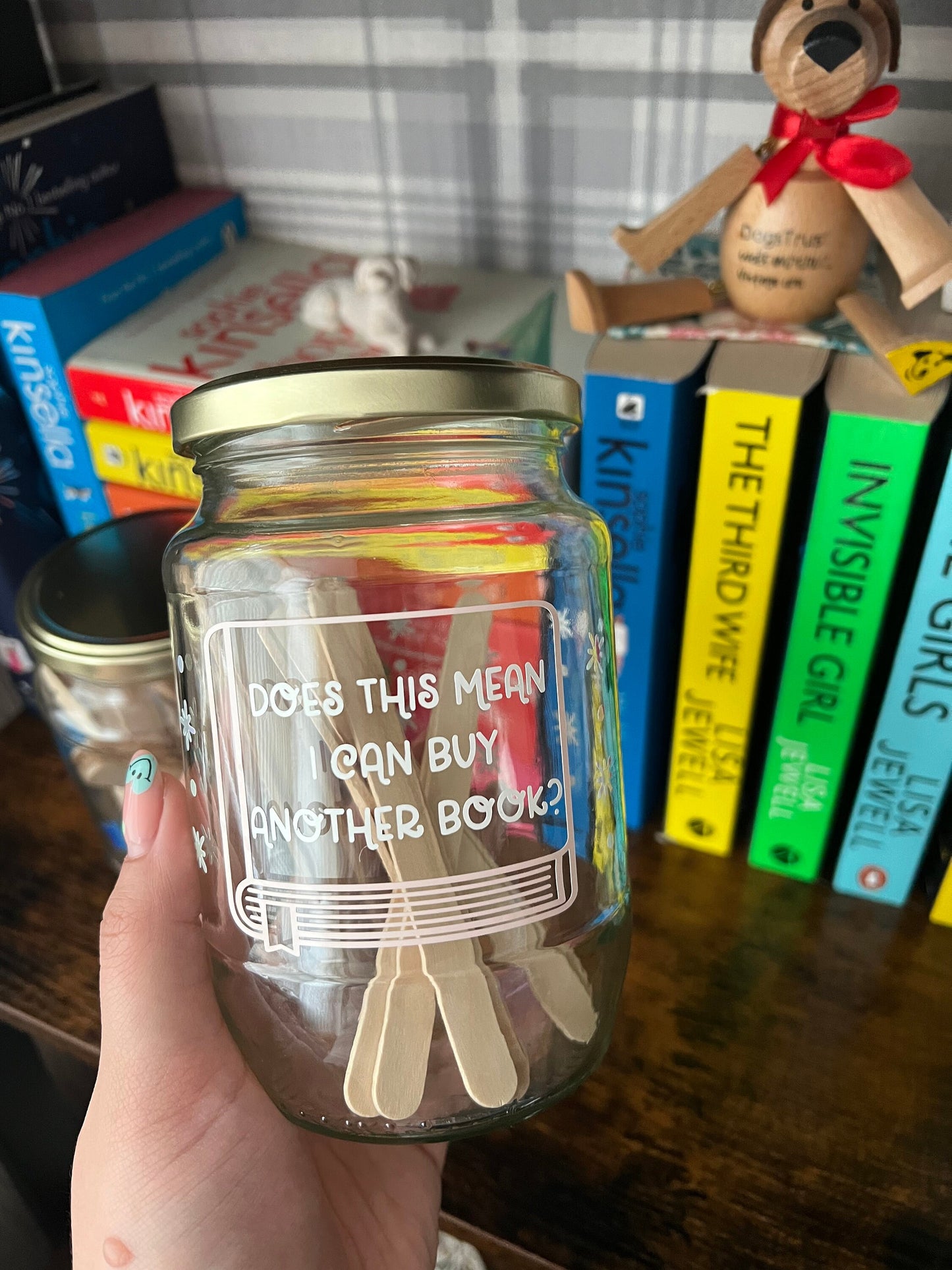 Books to be read and Tracker glass jars with gold lid