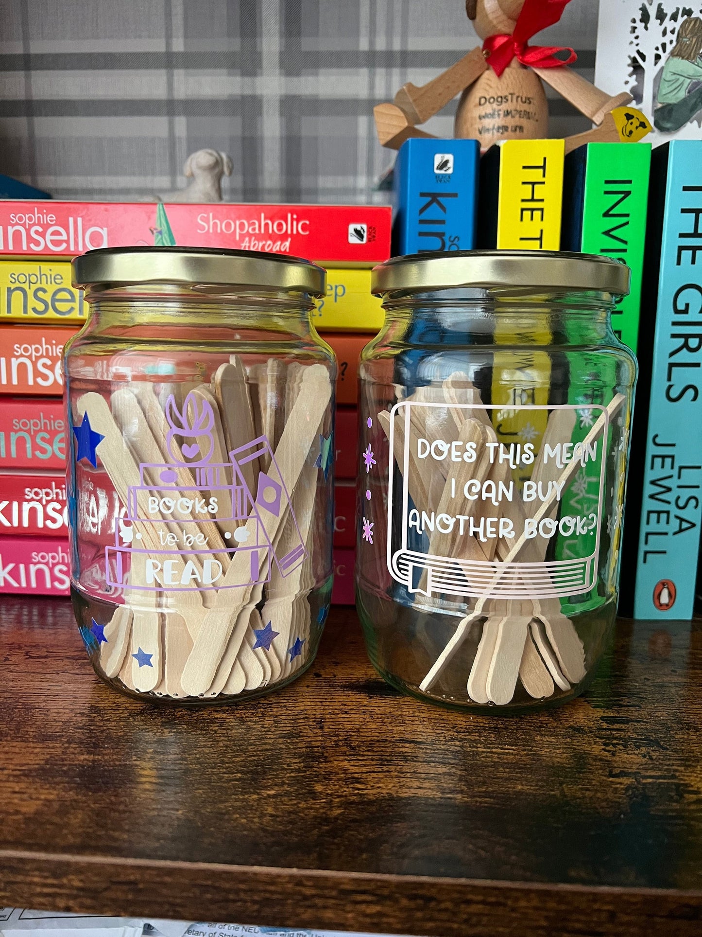 Books to be read and Tracker glass jars with gold lid